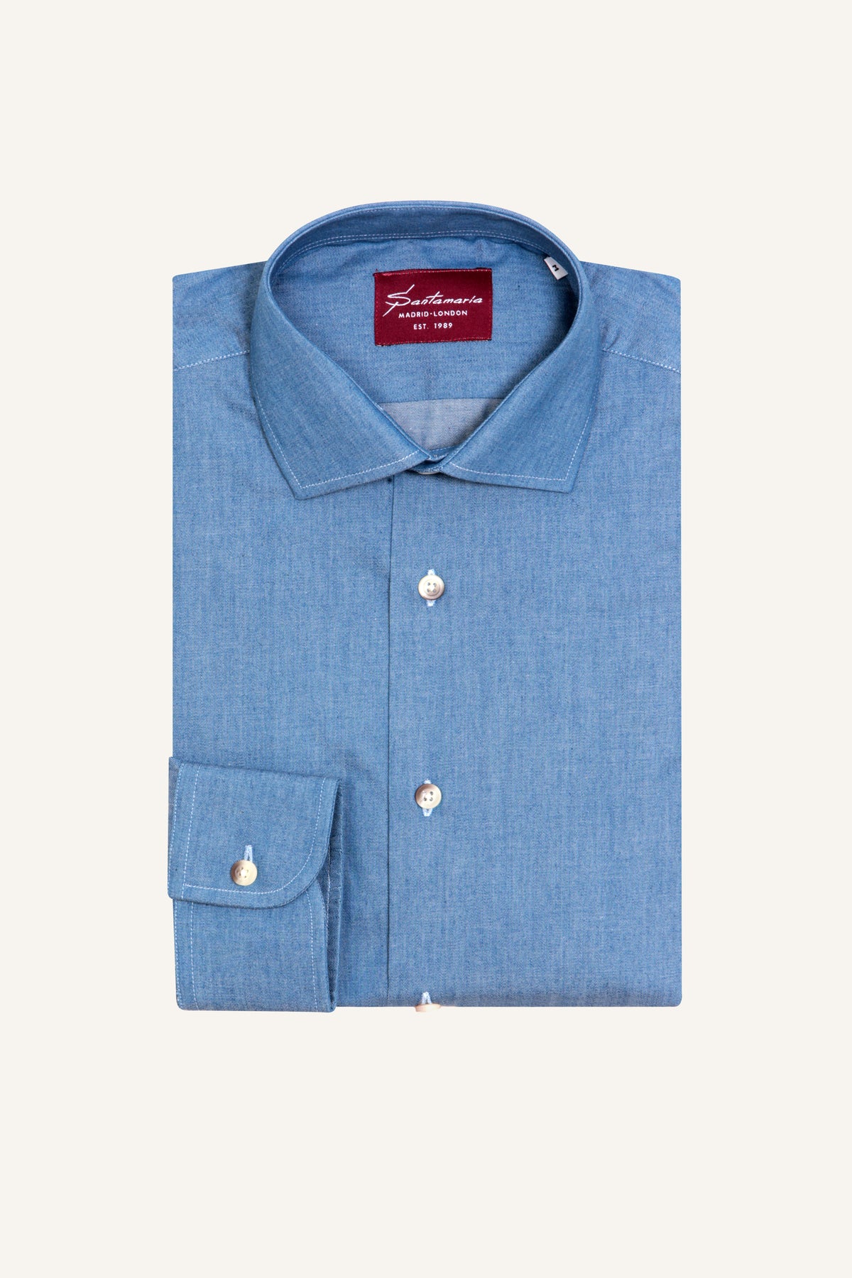 Blue chambray shirt with Italian spread collar, flat lay