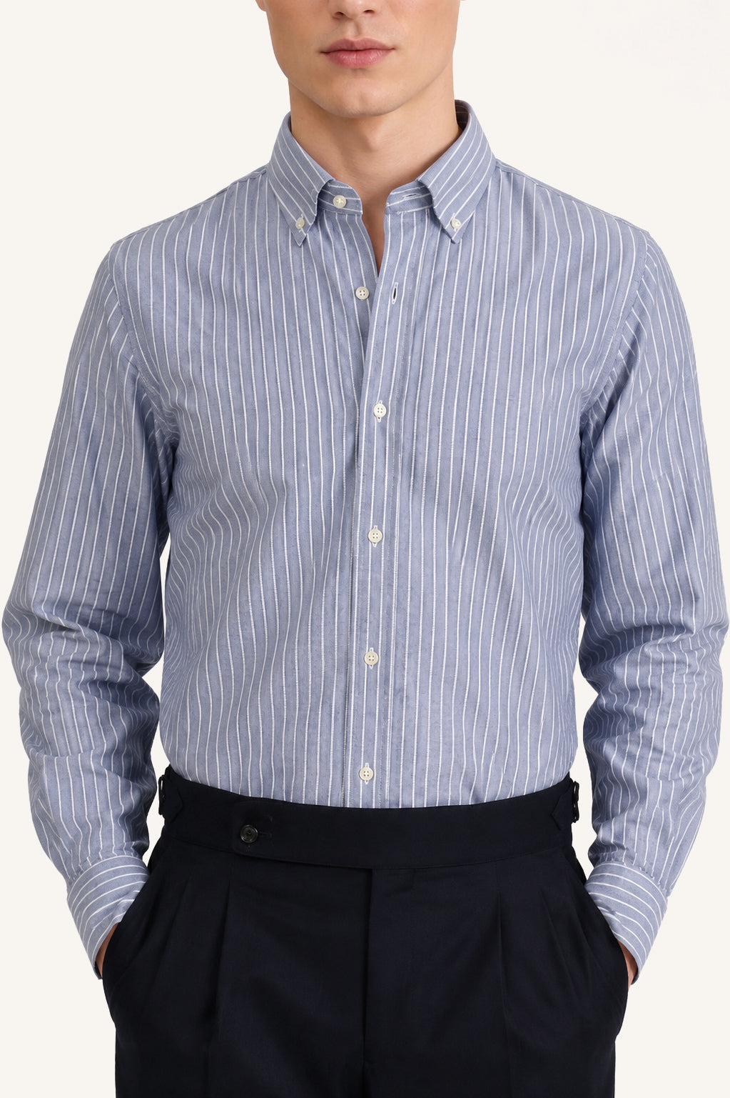 Men’s blue Oxford button-down shirt with white stripe, worn
