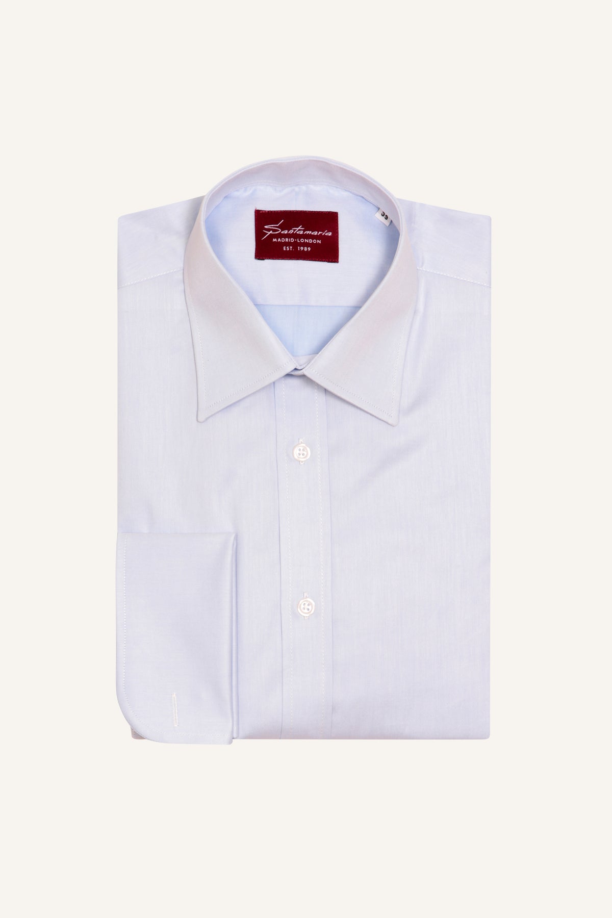 Blue twill double cuff shirt with English point collar, flat lay