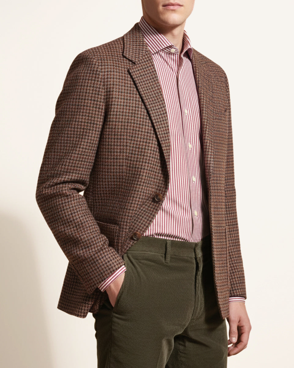 Man wearing a brown and burgundy check cashmere blazer by Justo Gimeno for Santamaria