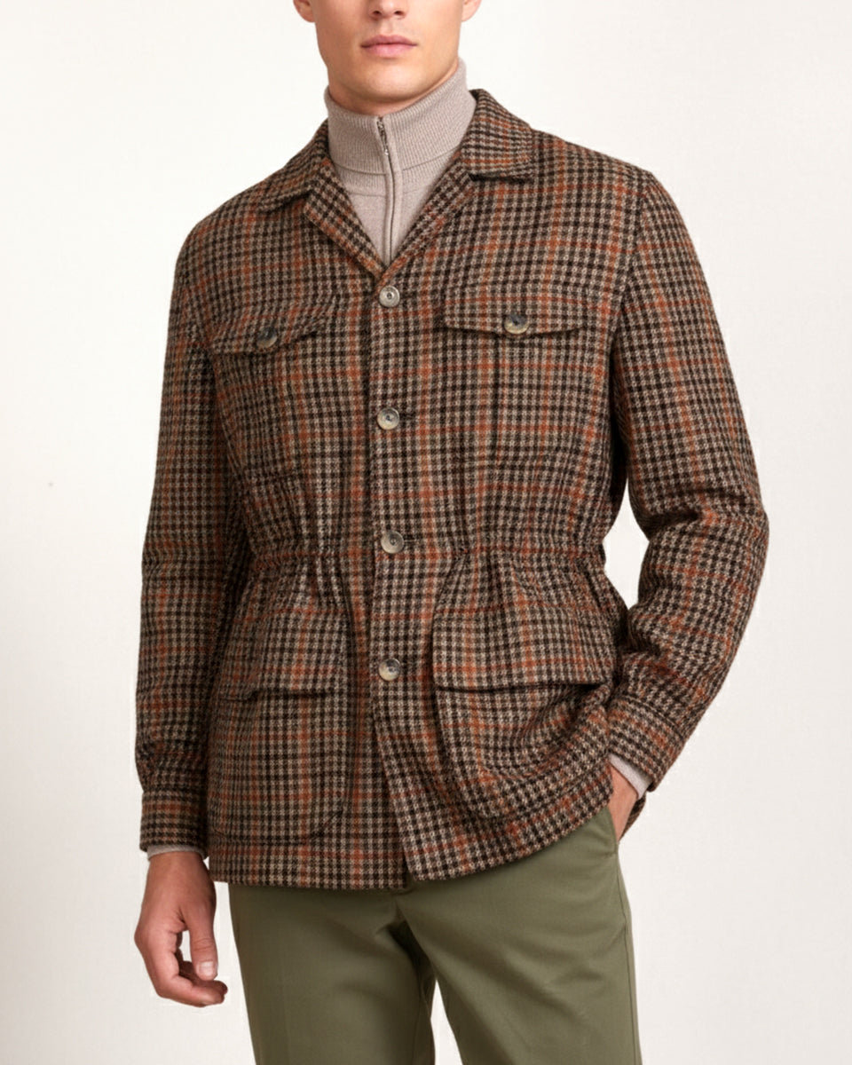 Man wearing a brown check cashmere safari jacket by Justo Gimeno for Santamaria