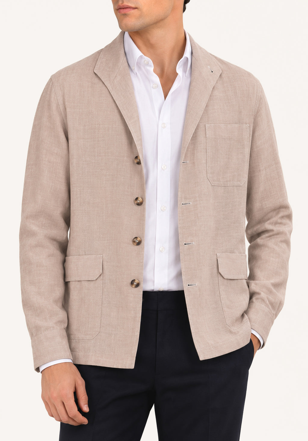 Man wearing a cream linen Teba jacket by Justo Gimeno for Santamaria