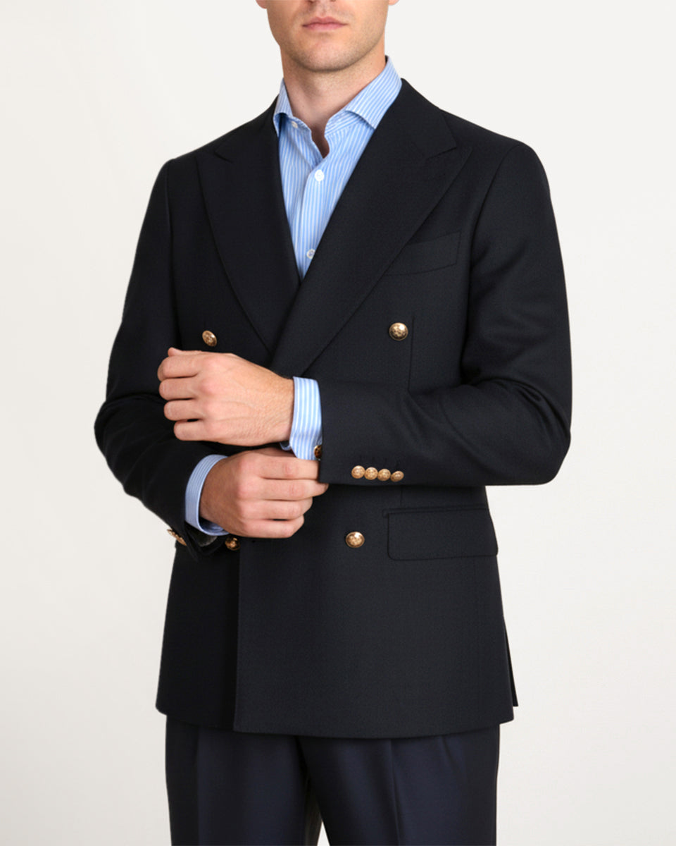 Man wearing a navy wool and silk blazer with gold buttons by Santamaria