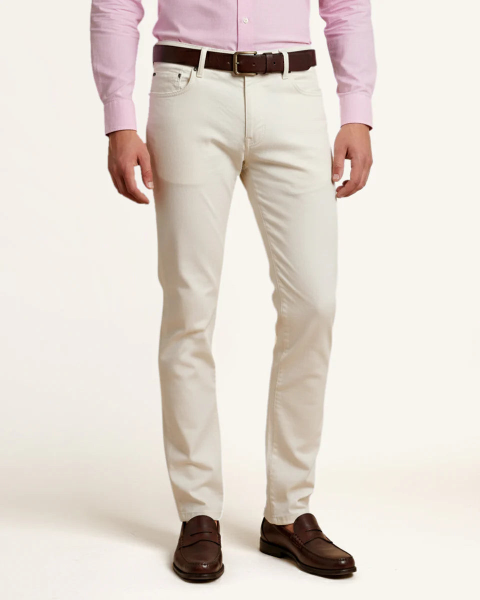 Man wearing white five-pocket cotton trousers by Santamaria