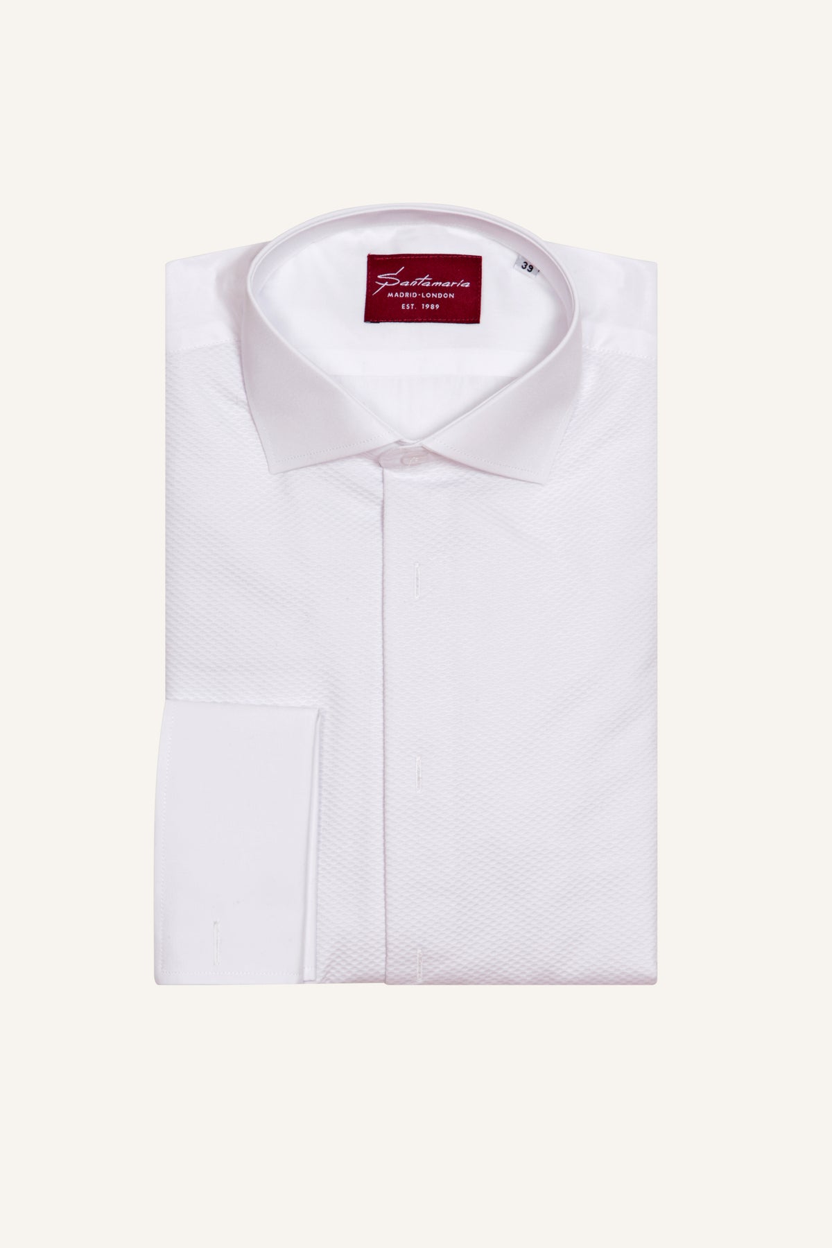 Men’s white piqué tuxedo shirt with double cuffs, flat lay